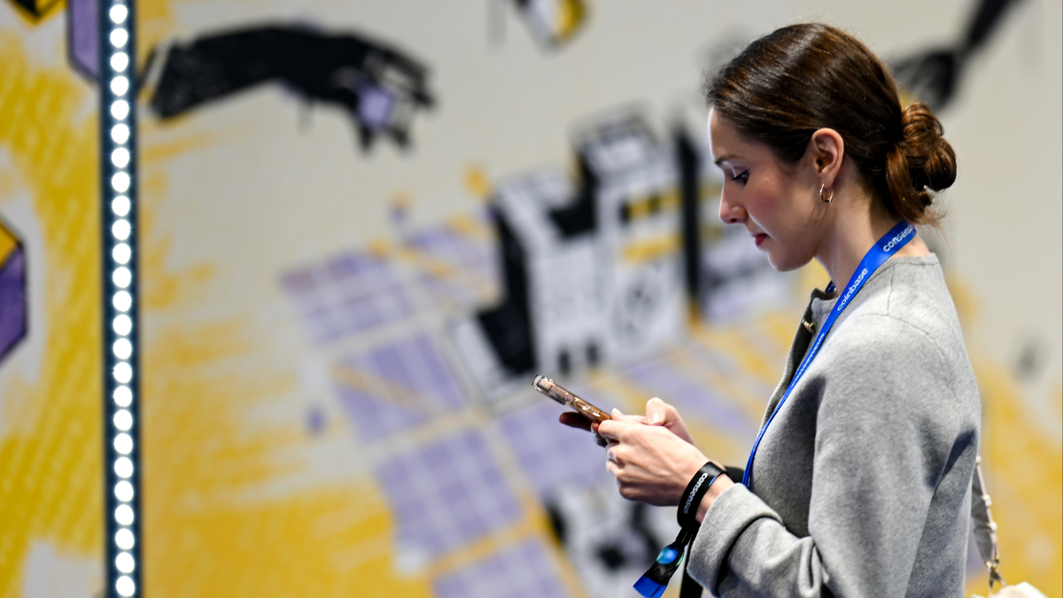 Attendee using the Consensus networking app